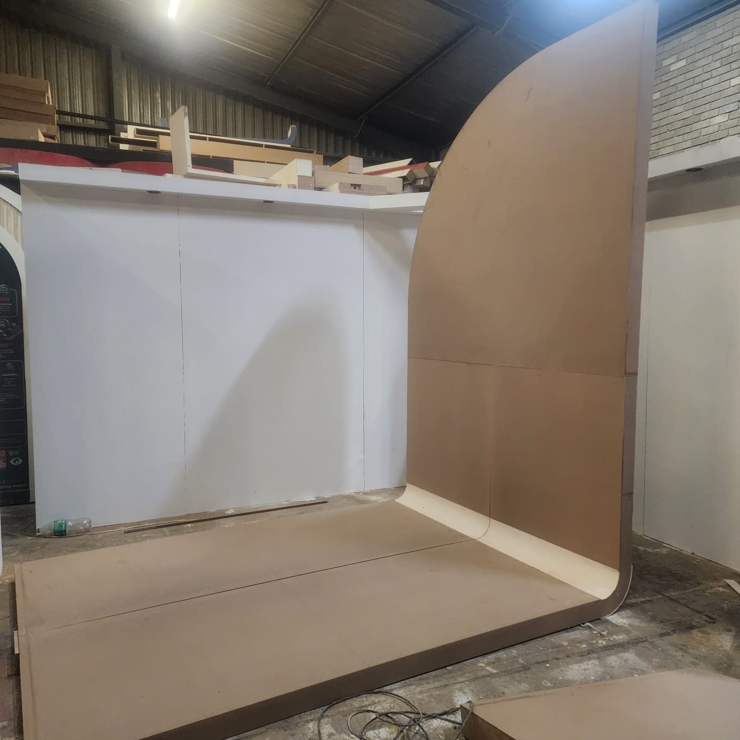 Custom exhibition stand shell build with curved walls in progress