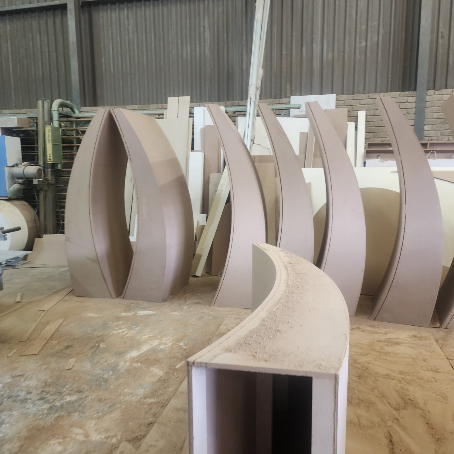 Curved timber stand panels being fabricated in the workshop