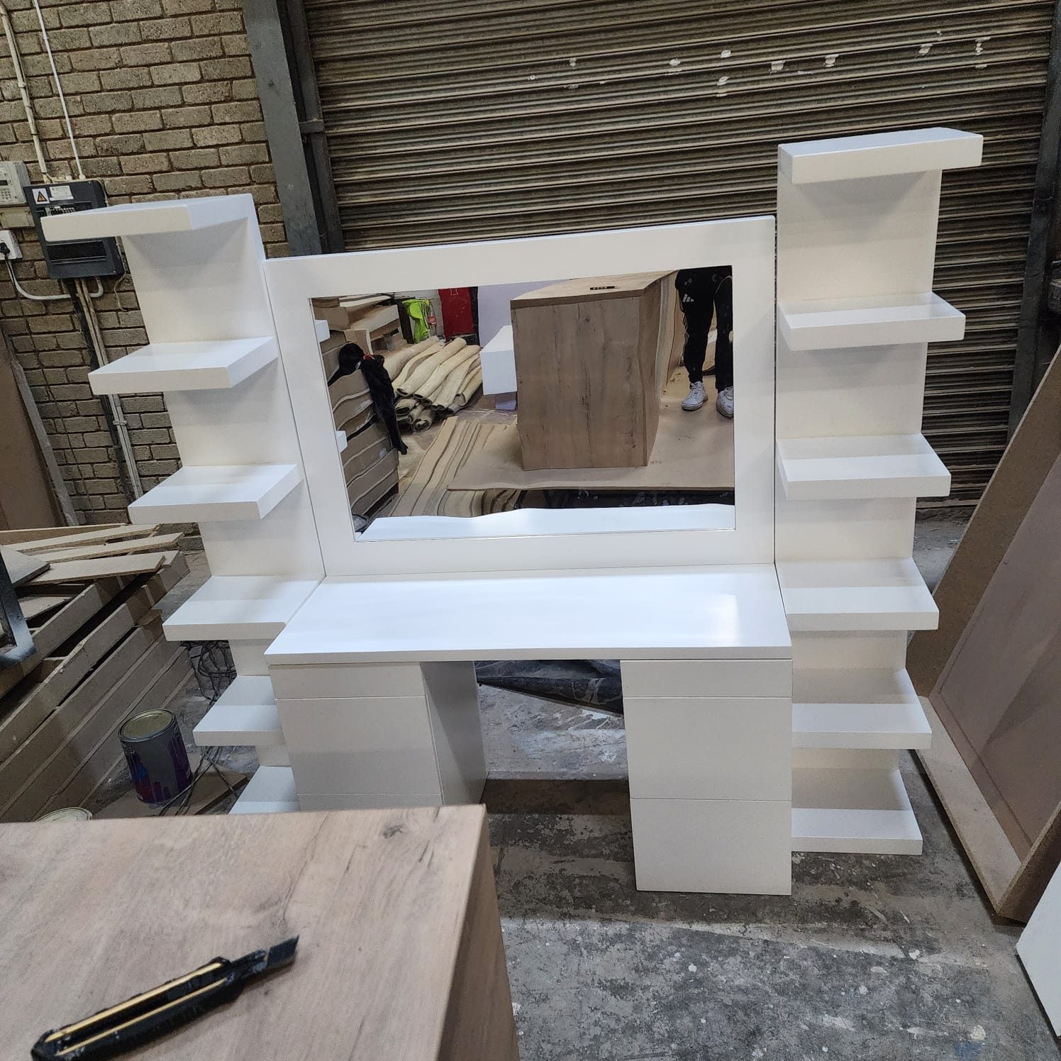 White fabricated display shelving units ready for installation